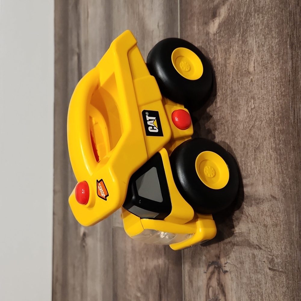 Caterpillar dump truck toy with lights and sounds